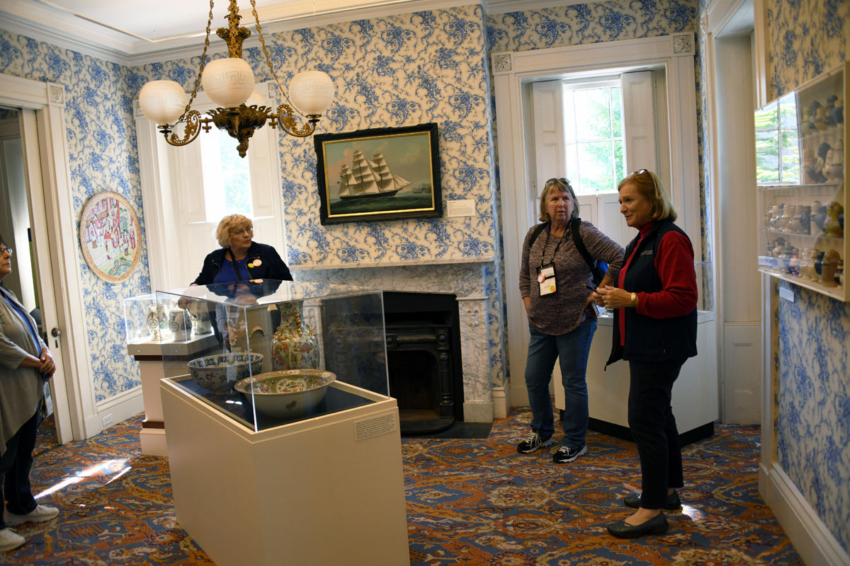 112 B.Mettenbrink and Joan Gocke listen to the docent explain the collections at the Hadwen House.jpg